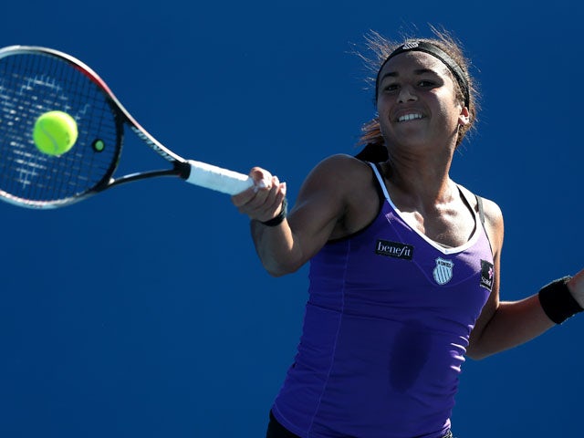 Heather Watson hits a forehand return shot during her first round match with Alexandra Cadantu at the Australian Open tennis championship on January 14, 2013