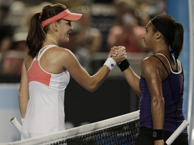Heather Watson of Britain congratulates Poland's Agnieszka Radwanska after defeating her in the third round at the Australian Open tennis championship on January 18, 2013