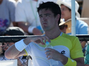 Britain's Jamie Baker during a break in play in his first round match at the Australian Open tennis championship on January 15, 2013