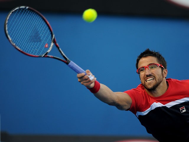 Serbia's Janko Tipsarevic stretches for the ball during his second round match at the  Australian Open tennis championship on January 16, 2013