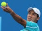 Kei Nishikori of Japan makes a serve during his first round match at the Australian Open tennis championship on January 14, 2013