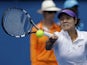 China's Li Na makes a forehand return during her first round match against Sesil Karatantcheva at the Australian Open tennis championship on January 14, 2013