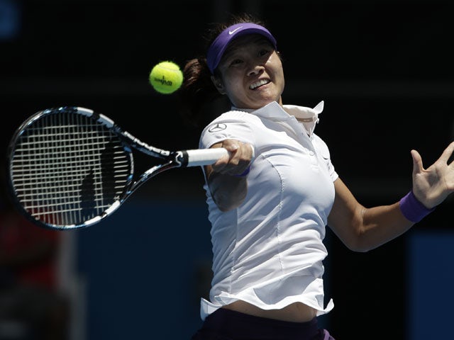 China's Li Na hits a return in her second round match at the Australian Open tennis championship on January 16, 2013