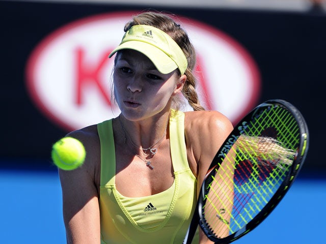 Maria Kirilenko from Russia returns a shot in her first round match against Vania King at the Australian Open tennis championship on January 15, 2013)