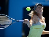 Russia's Maria Sharapova hits a forehand return in her fourth round match at the Australian Open tennis championship on January 20, 2013