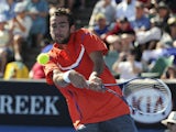Marin Cilic of Croatia hits a return shot during his first round match with Marinko Matosevic at the Australian Open tennis championship on January 15, 2013