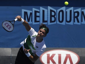 Milos Raonic of Canada serves to Jan Hajek in their first round match at  the Australian Open tennis championship on January 15, 2013