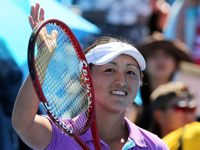 Misaki Doi of Japan thanks the crowd after her first round win over Petra Martic at the Australian Open tennis championship on January 14, 2013
