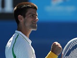 Novak Djokovic celebrates defeating Paul-Henri Mathieu at the Australian Open tennis championship on January 13, 2013