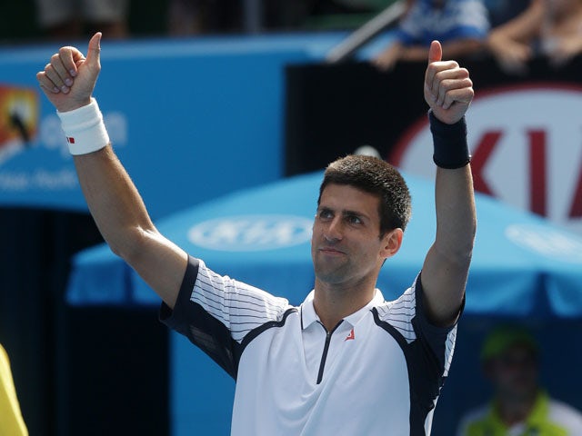 Novak Djokovic celebrates defeating Radek Stepanek in the third round at the Australian Open tennis championship on January 18, 2013