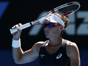 Stosur eases past Peng