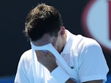 German Tobias Kamke wipes away sweat during his second round match at the Australian Open tennis championship on January 16, 2013
