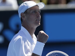 Tomas Berdych celebrates after his first round win at the Australian Open tennis championship on January 14, 2013