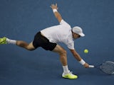 Tomas Berdych reaches for the ball during his third round match against Jurgen Meltzer at the Australian Open tennis championship on January 18, 2013