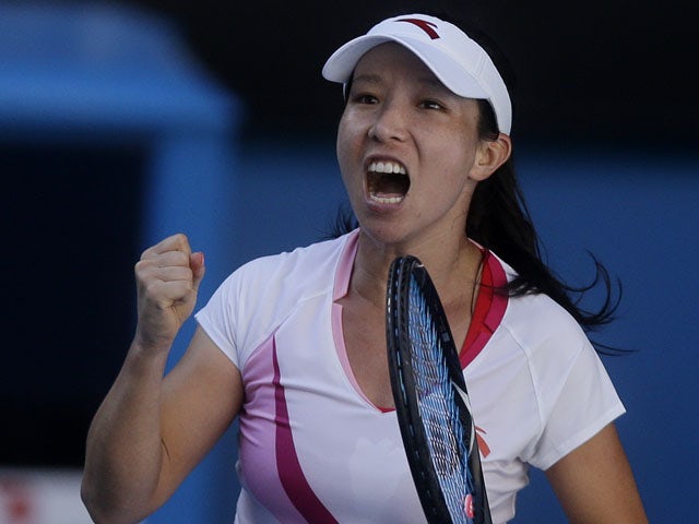 China's Zheng Jie celebrates during her second round with at the Australian Open tennis championship on January 16, 2013