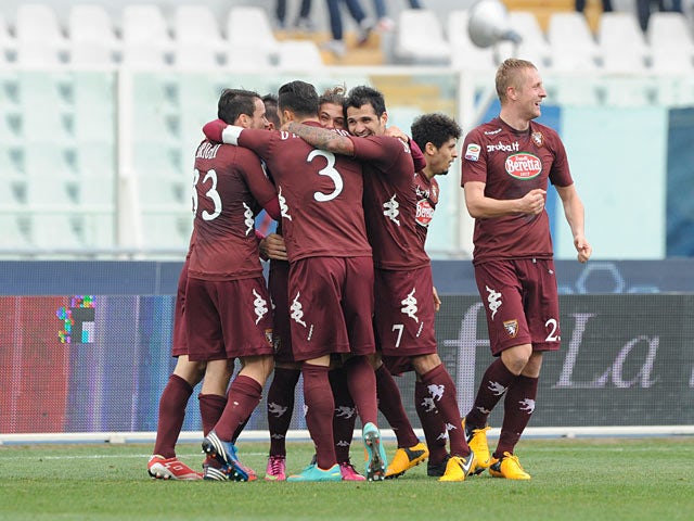 Torino's Alessio Cerci is congratulated by team mates after scoring his team's second against Pescara on January 20, 2013