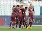 Torino's Alessio Cerci is congratulated by team mates after scoring his team's second against Pescara on January 20, 2013