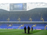 Groundstaff at White Hart Lane clear the snow from the pitch ahead of the match against Manchester United on January 20, 2013
