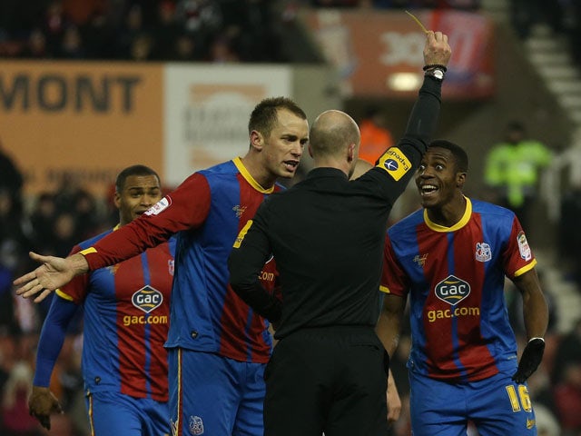 Crystal Palace player Wilfried Zaha is booked for diving in his sides FA Cup third round replay on January 15, 2013