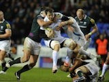 London Irish's Declan Danaher tackles Exeter Chiefs' Aly Muldowney on November 25, 2012