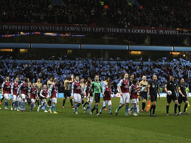 The Aston Villa and Bradford teams arrive on the pitch before their semi-final second leg on January 22, 2013