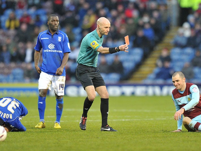 Burnley player Dean Marney is shown a red card following a challenge in his side's match with Birmingham on January 26, 2013