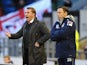 Opposing managers Brendan Rodgers and Paul Dickov stand on the touchline during the game between Oldham and Liverpool on January 27, 2013