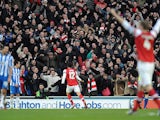 Arsenal player Oliver Giroud celebrates scoring his second goal in his sides match with Brighton and Hove Albion on January 26, 2013