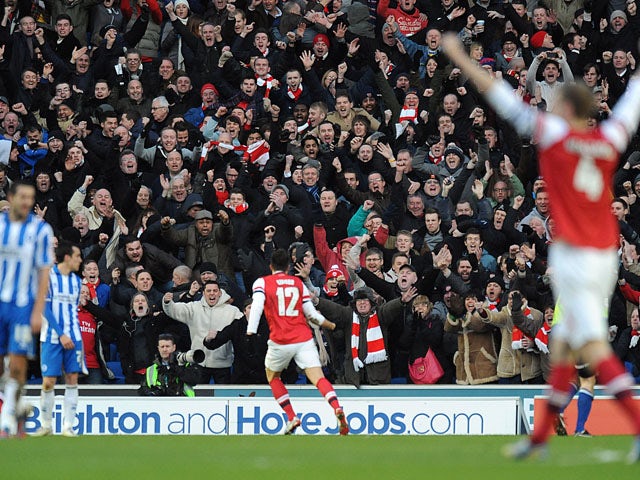 Arsenal player Oliver Giroud celebrates scoring his second goal in his sides match with Brighton and Hove Albion on January 26, 2013