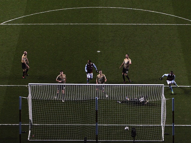 Villa striker Christian Benteke opens the scoring against Bradford on January 22, 2013
