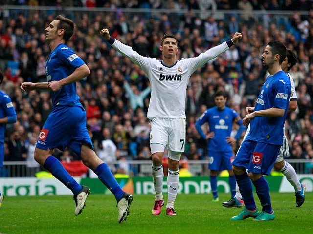 Cristiano Ronaldo celebrates scoring in the match against Getafe on January 27, 2013