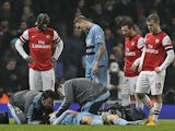 Daniel Potts receives treatment on the pitch during the match against Arsenal on January 23, 2013