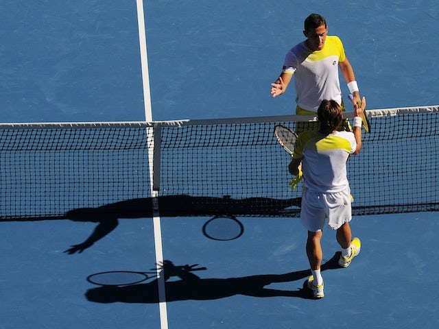 David Ferrer and Nicolas Almagro shake hands following their Australian Open quarter-final on January 22, 2013