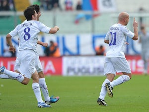 Fiorentina goalscorer Giulio Migliaccio is congratulated by team mates to celebrate the opening goal against Catania on January 27, 2013