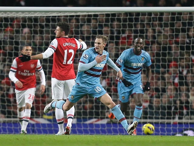 Jack Collison celebrates after scoring the opening goal against Arsenal on January 23, 2013