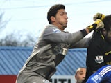 Wigan goalkeeper Joel Robles in action against Macclesfield on January 26, 2013