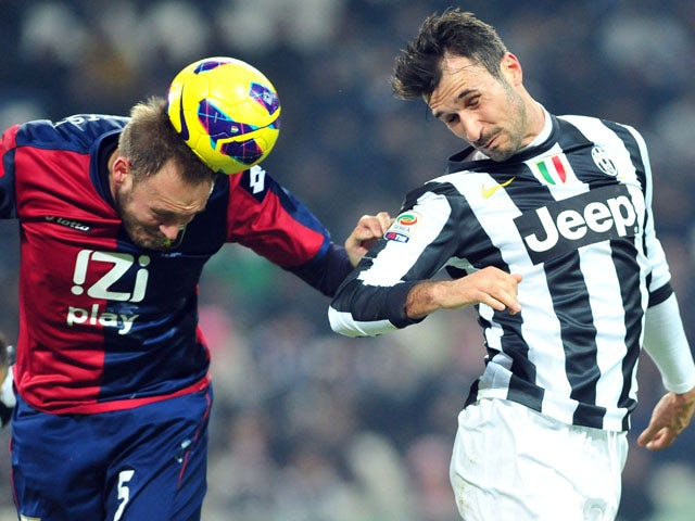 Genoa's Andreas Granqvist heads the ball in his team's match with Juventus on January 26, 2013