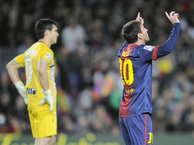 Barcelona's Lionel Messi celebrates after one of his four goals against Osasuna on January 27, 2013