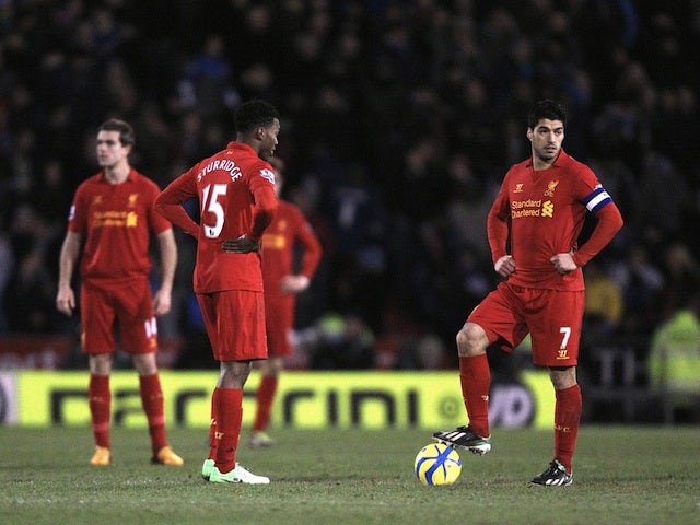 Liverpool pair Luis Suarez and Dan Sturridge stand dejected over the ball before kick-off, following the third Oldham goal on January 27, 2013