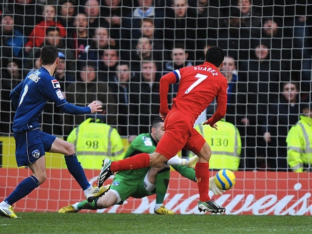 Liverpool's Luis Suarez makes it 1-1 against Oldham on January 27, 2013