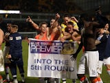 Luton Town players celebrate after defeating Norwich in the FA Cup fourth round on January 26, 2013