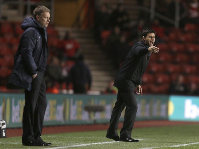 New Southampton manager Mauricio Pochettino (right) and his opposite number David Moyes (left) watch their team's match on January 21, 2013