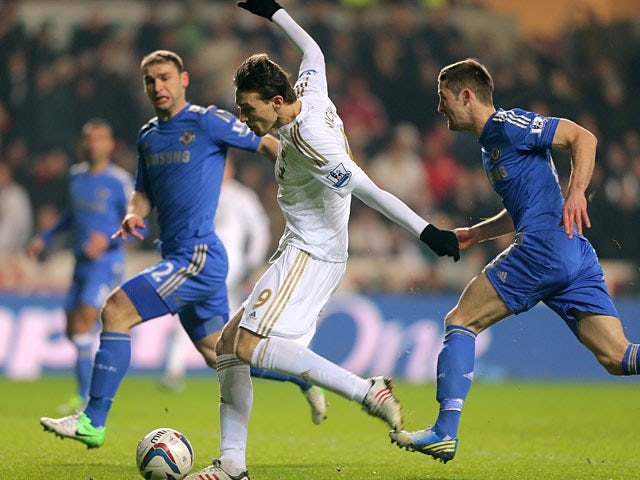 Miguel Michu beats the Chelsea defence to have a shot on goal on January 23, 2013