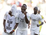 Ghana's Mubarak Wakaso (hidden) is congratulated on his goal against Mali by Kwadwo Asamoah on January 24, 2013