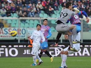 Catania's Nicola Legrottaglie scores the equaliser against Fiorentina on January 27, 2013