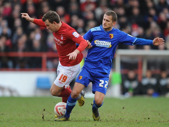 Nottingham Forest's Simon Cox is fouled by Watford player Almen Abdi in their Championship match on January 26, 2013