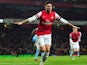 Olivier Giroud celebrates scoring his second and his team's fifth goal against West Ham on January 23, 2013