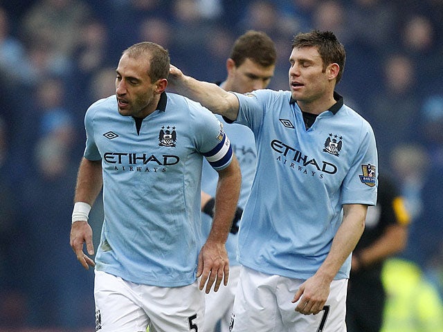 James Milner congratuates Pablo Zabaleta on his goal against Stoke during their FA Cup fourth round tie on January 26, 2013