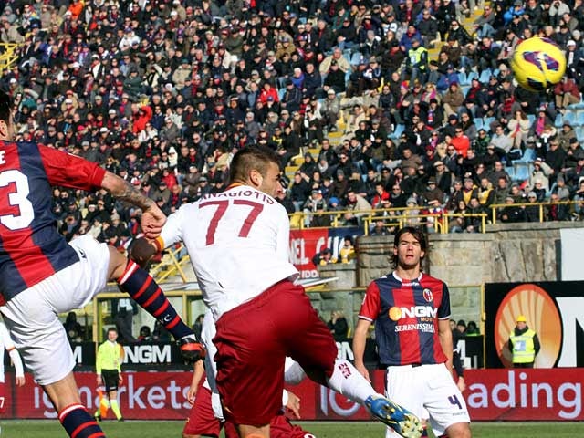 AC Roma's Panagiotis Tachtsidis heads in the equaliser against Bologna on January 27, 2013