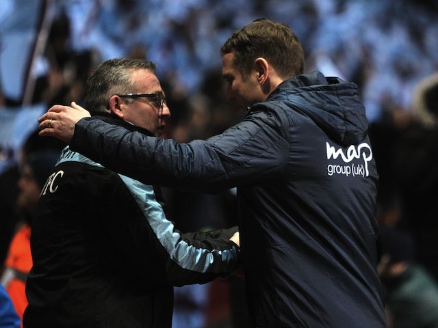 Villa boss Paul Lambert greets Bradford manager Phil Parkinson before the League Cup semi-final second leg on January 22, 2013